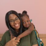 A portrait of a mom and her daughter.