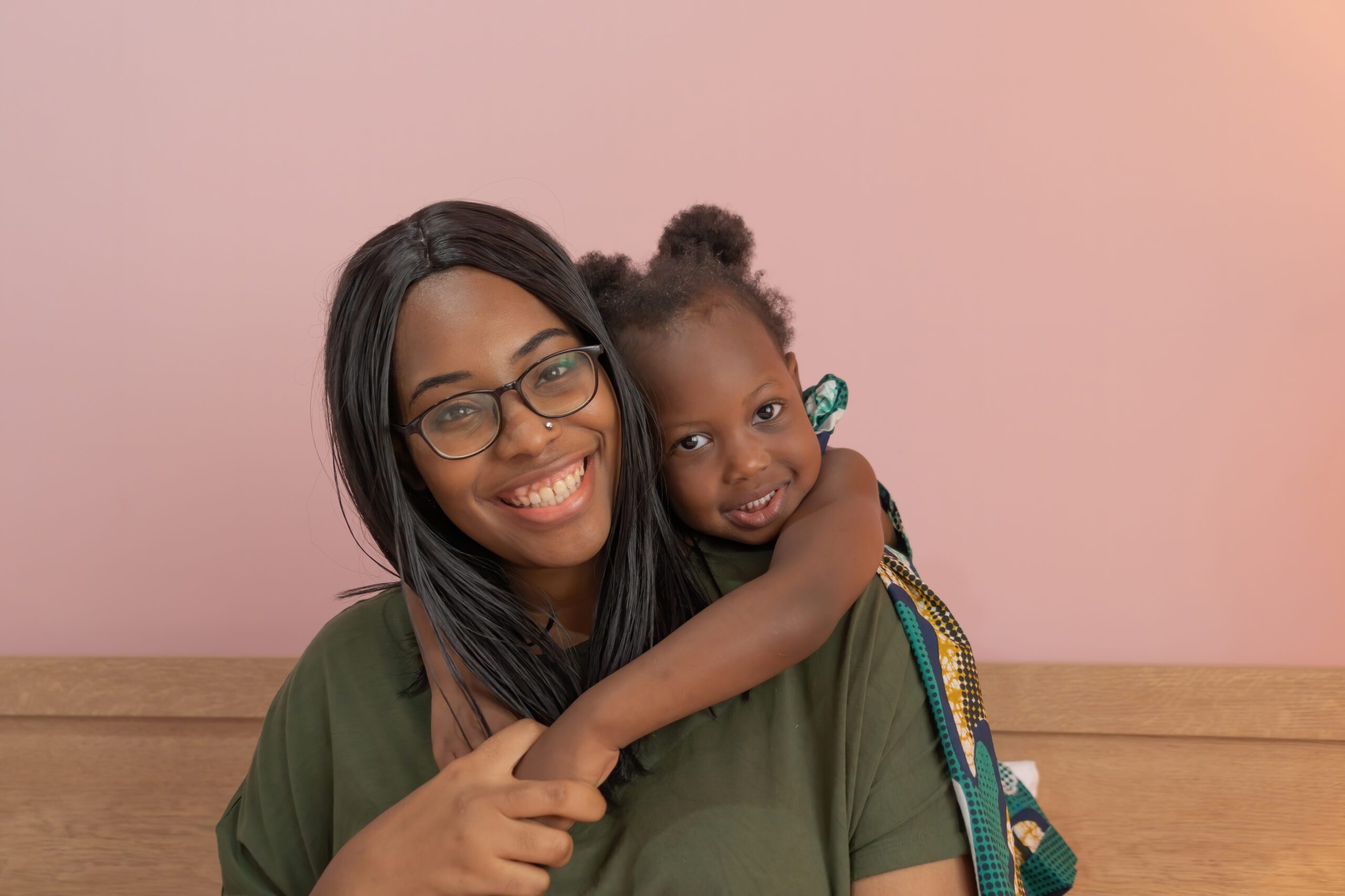 A portrait of a mom and her daughter.